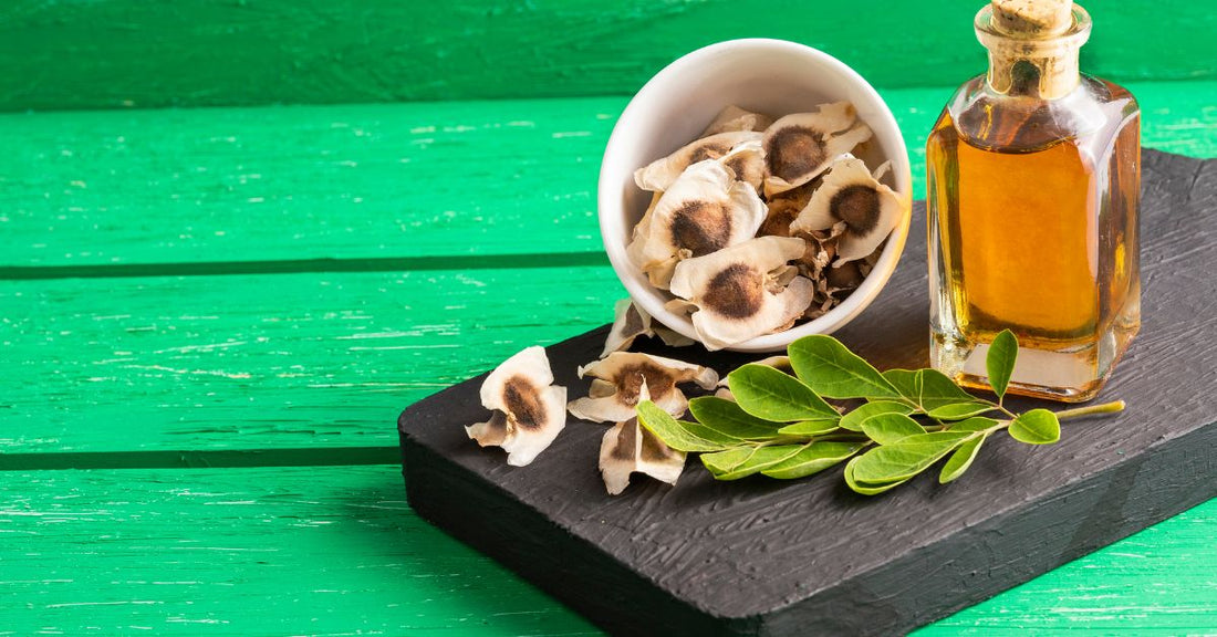 Close-up of Moringa leaf, seeds, and oil, symbolizing natural wellness and health benefits.