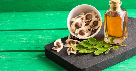 Close-up of Moringa leaf, seeds, and oil, symbolizing natural wellness and health benefits.