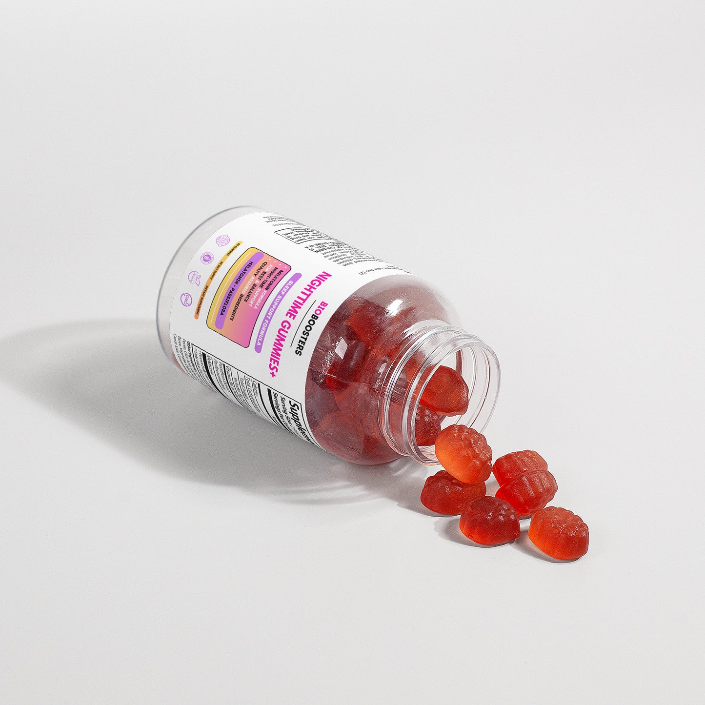 Bottle of red gummy supplements with a white label on a light gray background