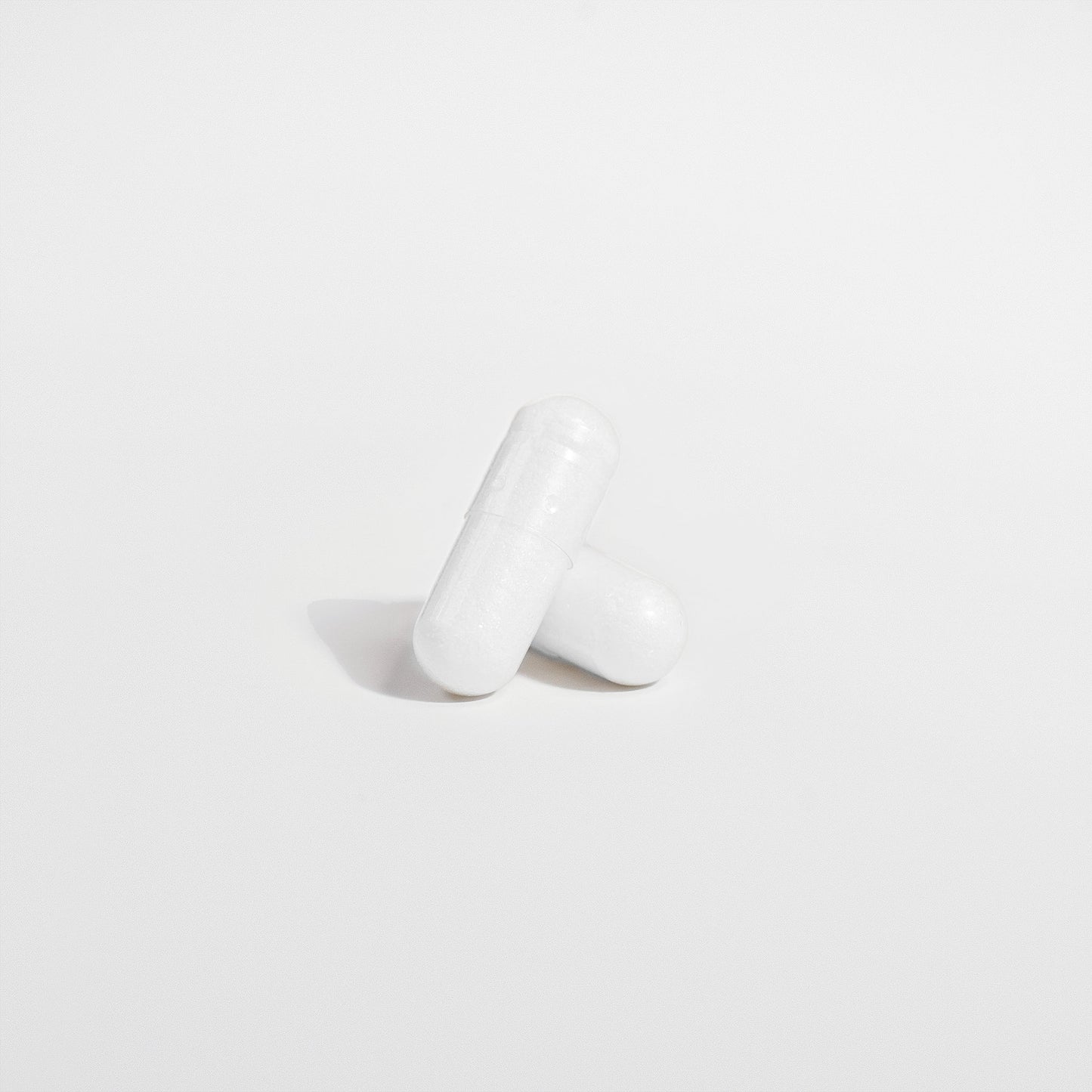 White ceramic vase on a light gray background